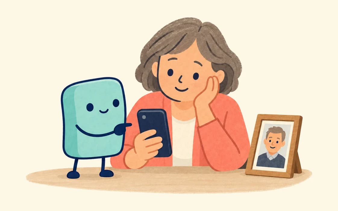 An older woman rests her cheek on her hand, smiling at her phone beside a framed photo of a man, while the agent points at the phone.